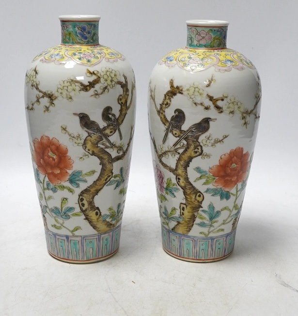 A pair of Chinese famille rose tapering vases, Qianlong mark but later, 23cm. Condition - good